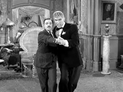 Lurch dancing with Gomez Addams (Lurch is on the right)
